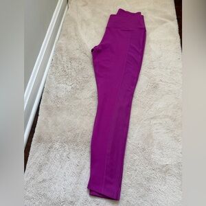 Nike Therma-FIT One women's mid-rise training leggings in a magenta color